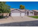 Two-story home with a two-car garage and solar panels at 2820 E Ranch Ct, Gilbert, AZ 85296