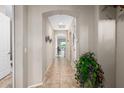 Bright hallway with tile flooring, leading to other rooms at 26264 W Matthew Dr, Buckeye, AZ 85396