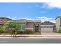 Beautiful two-story home with a two-car garage and well-maintained landscaping at 10020 E Strobe Ave, Mesa, AZ 85212