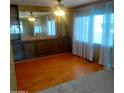 Bright dining area with wood-look flooring and built-in cabinetry at 3104 E Broadway Rd # 268, Mesa, AZ 85204