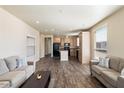 Open living room features wood-look floors and neutral-toned sofas at 8865 E Baseline Rd # 753, Mesa, AZ 85209