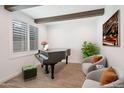 Elegant music room featuring a grand piano and comfortable seating at 11673 N 136Th St # 1022, Scottsdale, AZ 85259