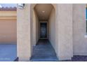 Covered entryway leading to front door of house at 19775 W Roma Ave, Litchfield Park, AZ 85340