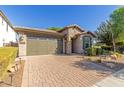 One-story home with a two-car garage and landscaped front yard at 3432 E Strawberry Dr, Gilbert, AZ 85298