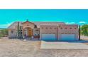 Two-story house with stucco exterior and a three-car garage at 19999 W Fawny Ln, Casa Grande, AZ 85122