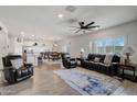 Open concept living room with hardwood floors and access to the kitchen at 12533 W Citrus Way, Litchfield Park, AZ 85340