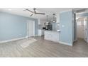 Light and airy living area with kitchen island view at 5011 S 20Th Pl, Phoenix, AZ 85040