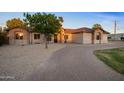 Front view of a two-story house with a brick driveway and landscaping at 21743 S 140Th St, Chandler, AZ 85286