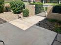 Landscaped front yard with walkway and gate at 9012 N 109Th Dr, Sun City, AZ 85351