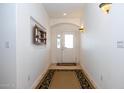 Bright entryway with tiled flooring and a built-in shelf at 8183 W Raven Dr, Arizona City, AZ 85123