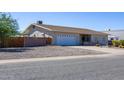 Charming single story home with a two car garage and gravel landscaping at 8183 W Raven Dr, Arizona City, AZ 85123