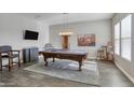 Game room boasts a pool table and seating area at 15201 S 183Rd Dr, Goodyear, AZ 85338