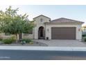 Charming house with a welcoming front entry and well-maintained landscaping at 27002 W Oraibi Dr, Buckeye, AZ 85396