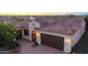 Single-story home with tile roof and a large backyard at 27002 W Oraibi Dr, Buckeye, AZ 85396