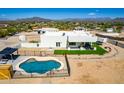 Aerial view of backyard oasis with sparkling pool and mountain views at 36627 N 18Th Dr, Phoenix, AZ 85086