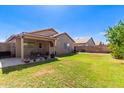 Covered patio with table and chairs, perfect for outdoor dining at 15924 W Elm St, Surprise, AZ 85374