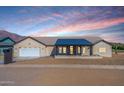 Modern house exterior with a covered porch and mountain views at 3939 S Veronica Ln, Gold Canyon, AZ 85118