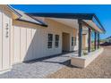 Modern house exterior with a covered porch and mountain views at 3939 S Veronica Ln, Gold Canyon, AZ 85118