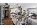 Spacious kitchen with granite countertops, island, and stainless steel appliances at 10737 E Simone Ave, Mesa, AZ 85212