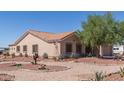 One-story house with a two-car garage and desert landscaping at 3630 N 372Nd Ln, Tonopah, AZ 85354