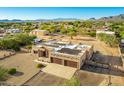 Aerial view of a large home with solar panels and a three-car garage at 2320 W Hidden Valley Dr, Phoenix, AZ 85086