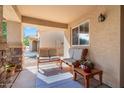 Covered front porch with seating area, perfect for relaxing at 1448 E Poncho Ln, San Tan Valley, AZ 85143