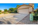 House exterior featuring a two-car garage and well-maintained landscaping at 4603 E Superior Rd, San Tan Valley, AZ 85143