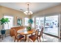 Bright dining room with sliding doors to patio at 18326 N Gila Springs Dr, Surprise, AZ 85374