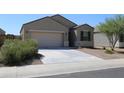 Newly built home with a two-car garage and drought-tolerant landscaping at 31021 W Columbus Ave, Buckeye, AZ 85396