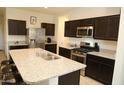Spacious kitchen featuring stainless steel appliances and granite countertops at 31021 W Columbus Ave, Buckeye, AZ 85396