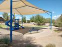 Playground with shaded seating and play equipment at 21042 E Camina Buena Vis, Queen Creek, AZ 85142