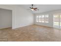 Open living room with tile floors and lots of natural light at 17613 N Kimberly Way, Surprise, AZ 85374