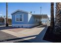 Charming light blue manufactured home with covered carport at 2601 E Allred Ave # Br24, Mesa, AZ 85204