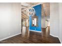 Bright dining room with hardwood floors and blue accent wall at 6120 N 31St Ct, Phoenix, AZ 85016