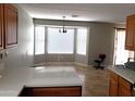 Bright dining area with bay window and tile floor at 1436 E Hidalgo Ave, Phoenix, AZ 85040