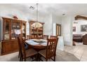 Bright dining room featuring a wood table and chairs, with built-in hutch at 1451 E Palm Beach Dr, Chandler, AZ 85249