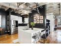 Modern kitchen with stainless steel appliances and island at 114 W Adams St # 808, Phoenix, AZ 85003