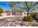 New construction home with a two-car garage and a paved driveway at 9407 S Calle Vauo Nawi --, Guadalupe, AZ 85283