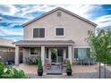 Spacious backyard patio with seating area and landscaping at 29101 N Yellow Bee Dr, San Tan Valley, AZ 85143