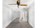 Bedroom with mirrored closet doors and ceiling fan at 1081 W 1St St # 7, Tempe, AZ 85281