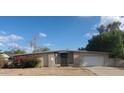 Ranch style home with a large front yard at 5937 W Coolidge St, Phoenix, AZ 85033