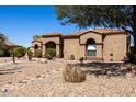 Spanish style home with attractive landscaping and walkway at 9301 W Debbie Ln, Arizona City, AZ 85123