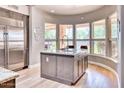 Kitchen island with granite countertop and stainless steel appliances at 7101 E Berneil Ln, Paradise Valley, AZ 85253