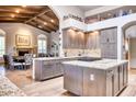 Gourmet kitchen with island, granite countertops, and ample cabinetry at 7101 E Berneil Ln, Paradise Valley, AZ 85253