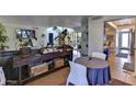Open dining area with a round table and view into the living room at 4525 N 66Th St # 48, Scottsdale, AZ 85251