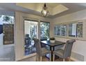 Kitchen dining area with patio access and a small table at 4525 N 66Th St # 48, Scottsdale, AZ 85251