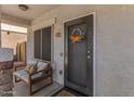Inviting front porch with a comfortable bench and stylish decor at 7715 S 69Th Ln, Laveen, AZ 85339