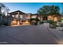 Luxury home with stone accents and a large driveway at 10626 E Palo Brea Dr, Scottsdale, AZ 85262
