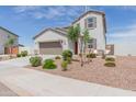 Two story house with attached garage and landscaping at 36545 N Herens Rd, San Tan Valley, AZ 85143