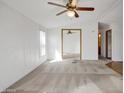 Spacious living room with carpeted floors and ceiling fans at 535 S Alma School Rd # 45, Mesa, AZ 85210